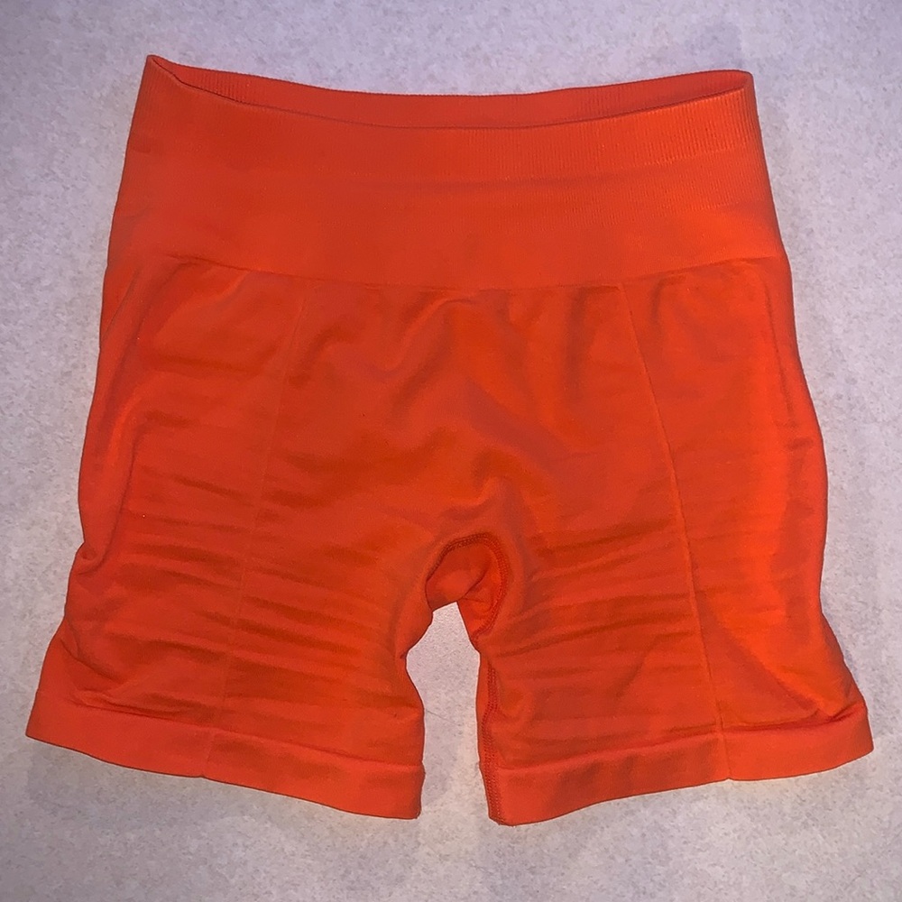 Brand: Fresought, orange workout shorts. Size Xs
